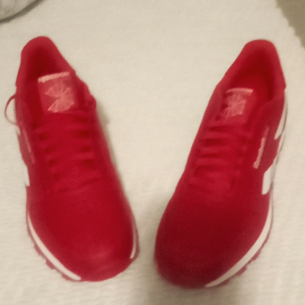 I'm selling a red and white Reebok shoe